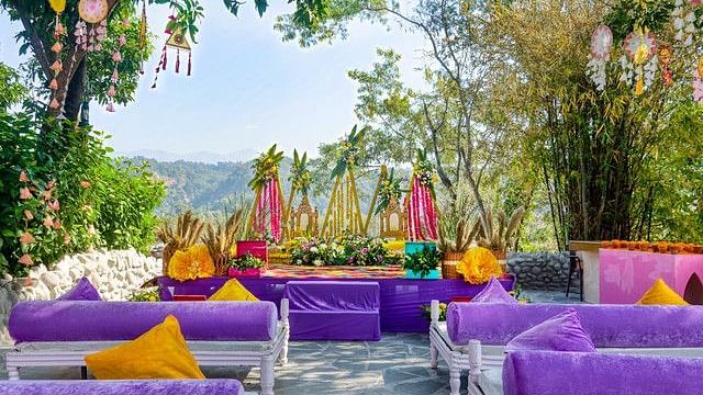 alt-text Outdoor wedding reception with tables and chairs.