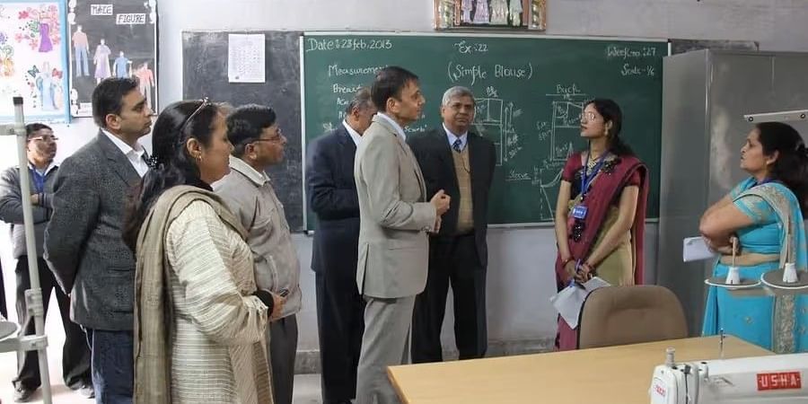 Visitors interacting with staff during a school visit