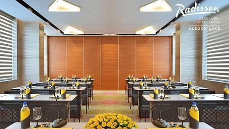Modern conference room at Radisson Bengaluru City Center, set up for meetings with elegant decor.