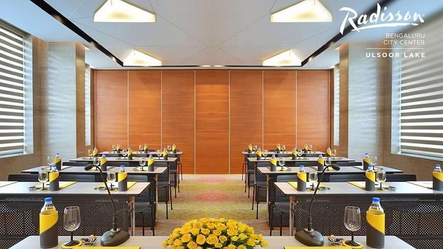 Modern conference room at Radisson Bengaluru City Center, set up for meetings with elegant decor.