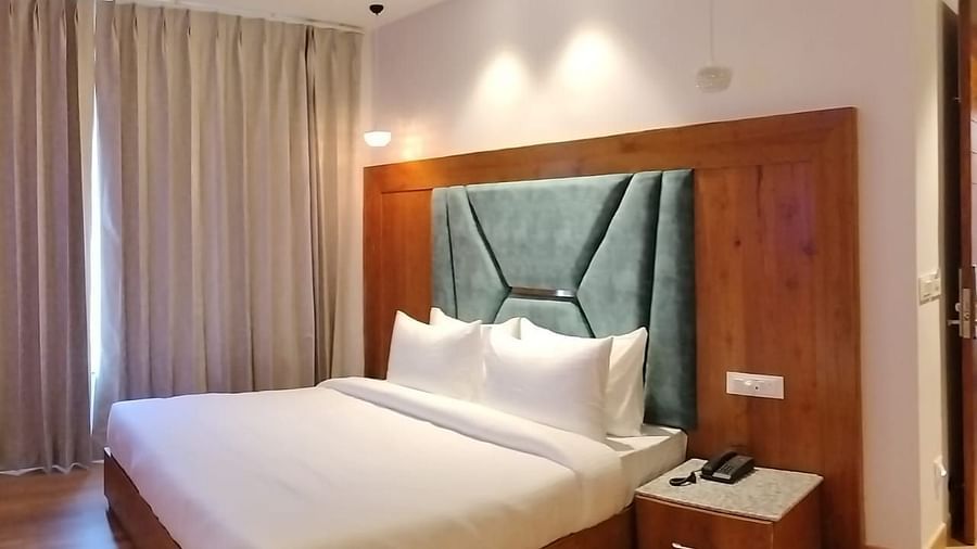 A large bed in Deluxe Non-view Room at DLS Ark Holiday Inn, Banikhet.