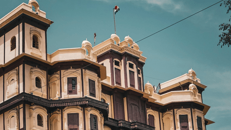 Side angle shot of Rajwada Palace a historic seven-story royal residence of the Holkar dynasty located in the heart of Indore.