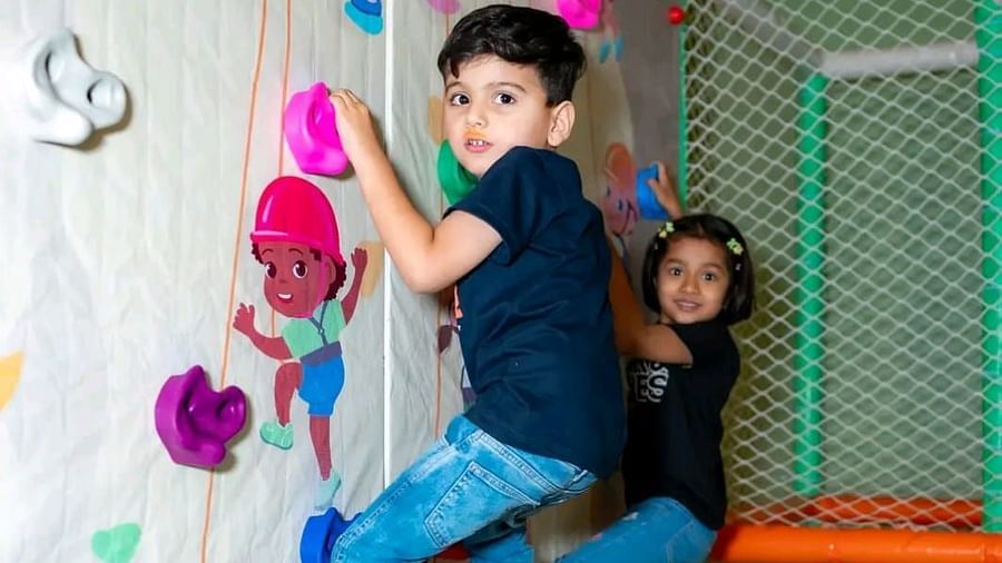 Children enjoying the wall climbing activity at Themis Barbecue House, Ambala