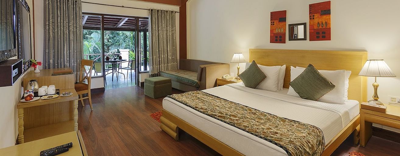 An image of a bedroom with king size bed, wooden ceiling where a fan is hanged,  cabinet and tables, etc. - The Riverview Retreat, Corbett