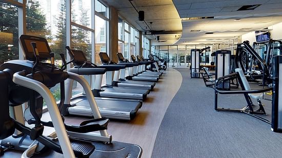 a gym stacked with treadmills