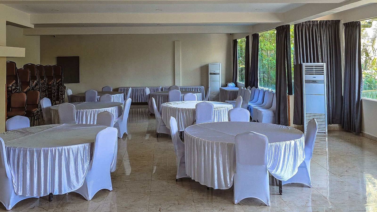 Spacious conference room with elegant round-table seating for meetings or functions at The Verda de Miranda Resort.