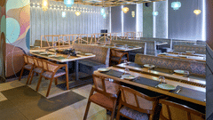 Stylish cafe seating with hanging lantern lights - Pride Elite Gandhinagar