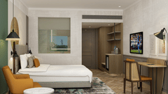 Room with pristine white bed covers, a work desk, a sofa and other amenities -  Sarovar Portico Srinagar