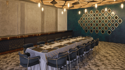 Sophisticated private dining room with long table and artistic walls - Pride Elite Gandhinagar