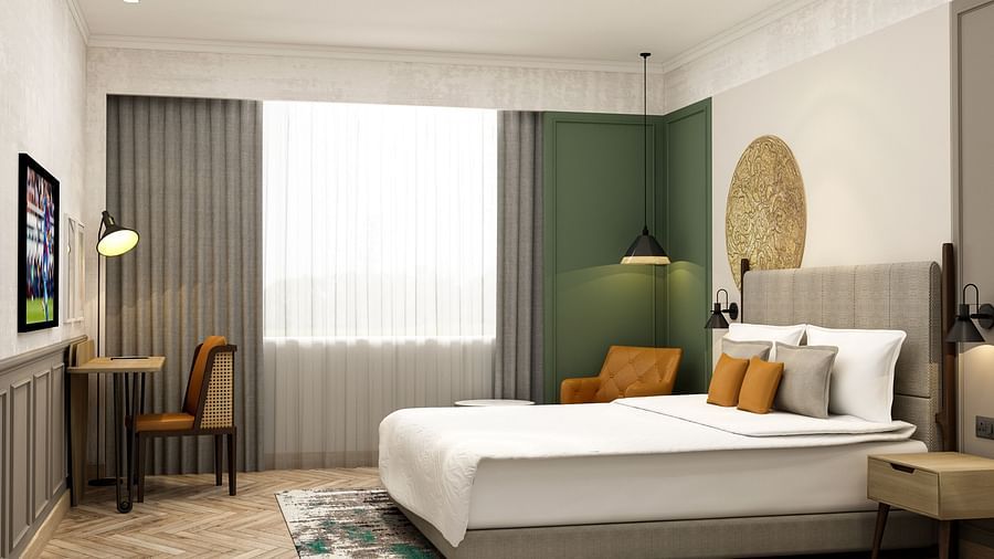 Side view of the room with pristine white bedsheets and grey curtains -  Sarovar Portico Srinagar