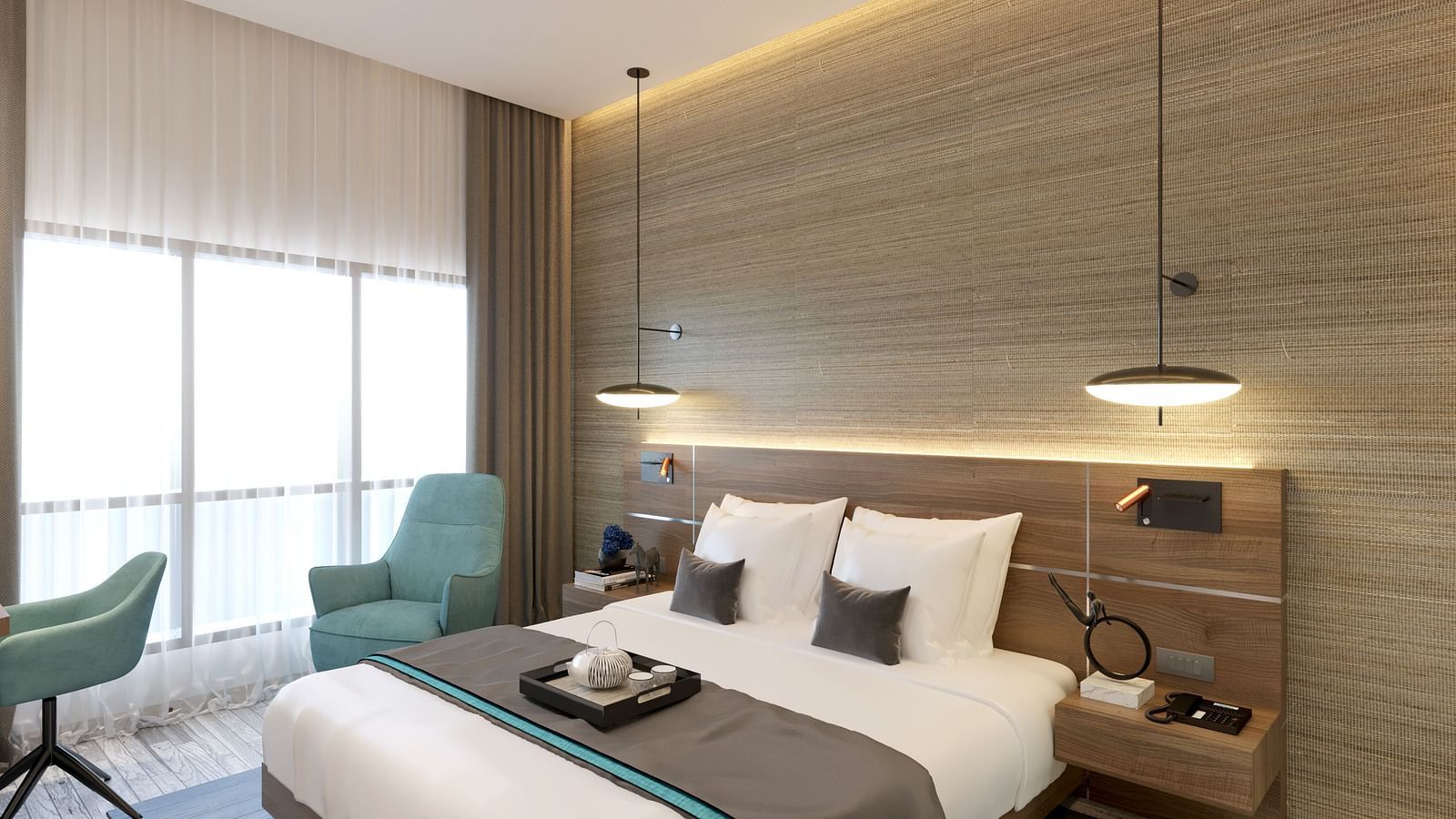 One Bedroom Suite in Kinshasa at Kertel Suites featuring a plush double bed with an arm chair besides it