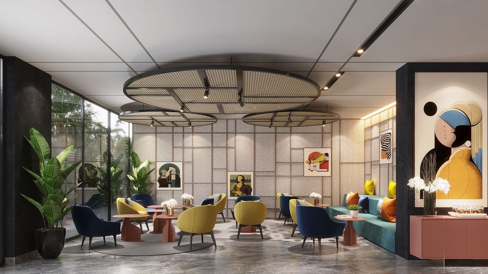 Wide angle shot of a modern lounge or waiting area with colourful armchairs, small tables, a decorative ceiling fixture, and artwork on the wall.