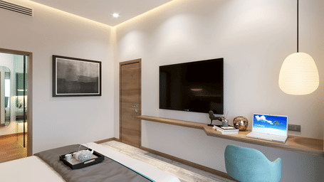 One Bedroom Suite in Kinshasa at Kertel Suites with a plush double bed along with a wall mounted television