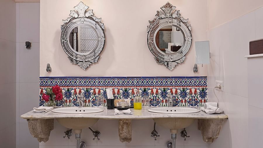 image of deluxe suite bathroom with antique mirror at Dev Shree, Deogarh
