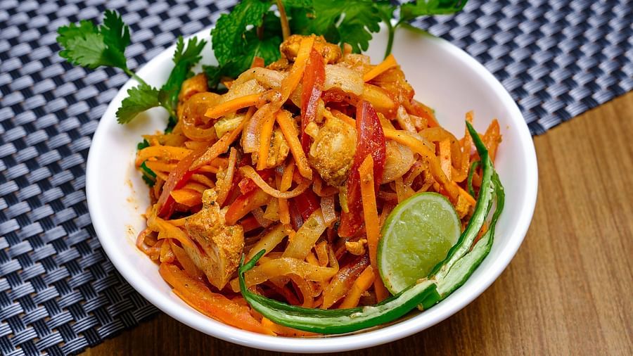 A bowl of salad placed on a table - Essentia Premier Hotel, Chennai