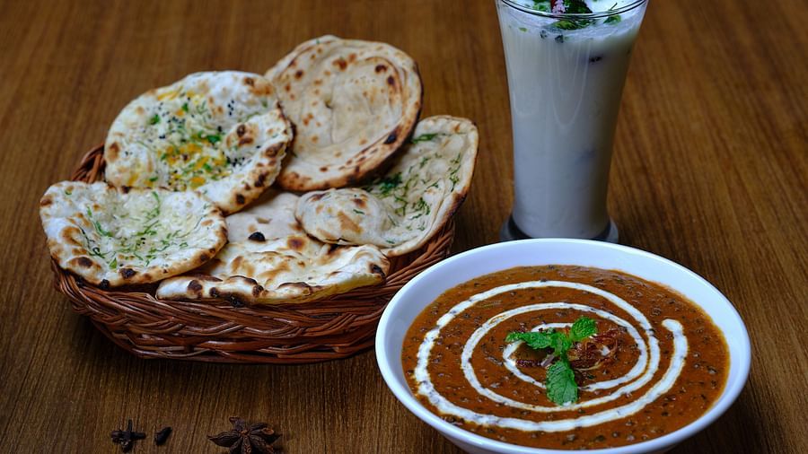 A bread basket served with a bowl of dal makhani at Essentia Premier Hotel, Chennai
