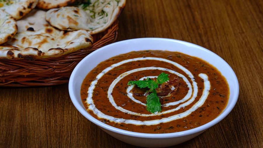 A bread basket served with a bowl of dal makhani at Essentia Premier Hotel, Chennai