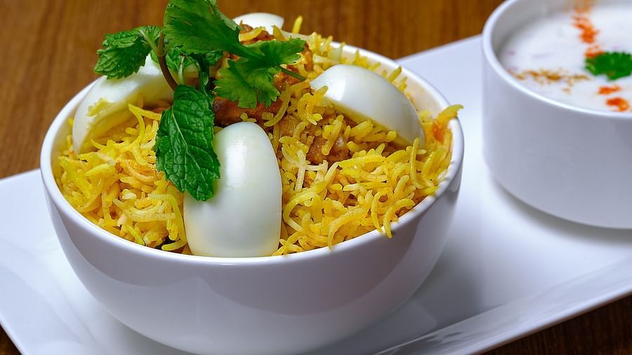 A biryani bowl topped with eggs being served at Essentia Premier Hotel, Chennai