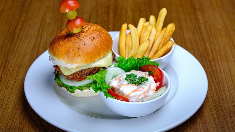 A burger served with some fries at Essentia Premier Hotel, Chennai
