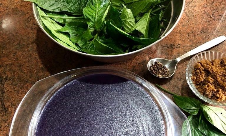 Ingredients for Maddh Thopp, including green leaves.