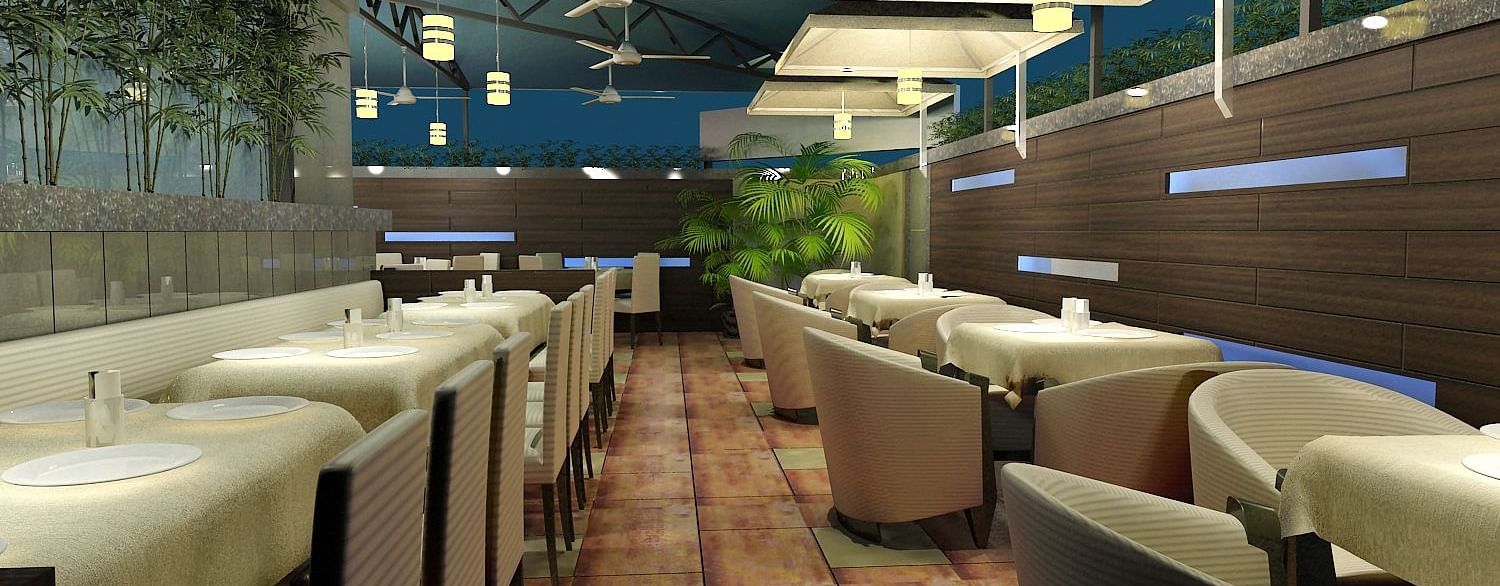 Outdoor dining area with chairs and tables arranged neatly, surrounded by plants at Oriental Aster, Mumbai.