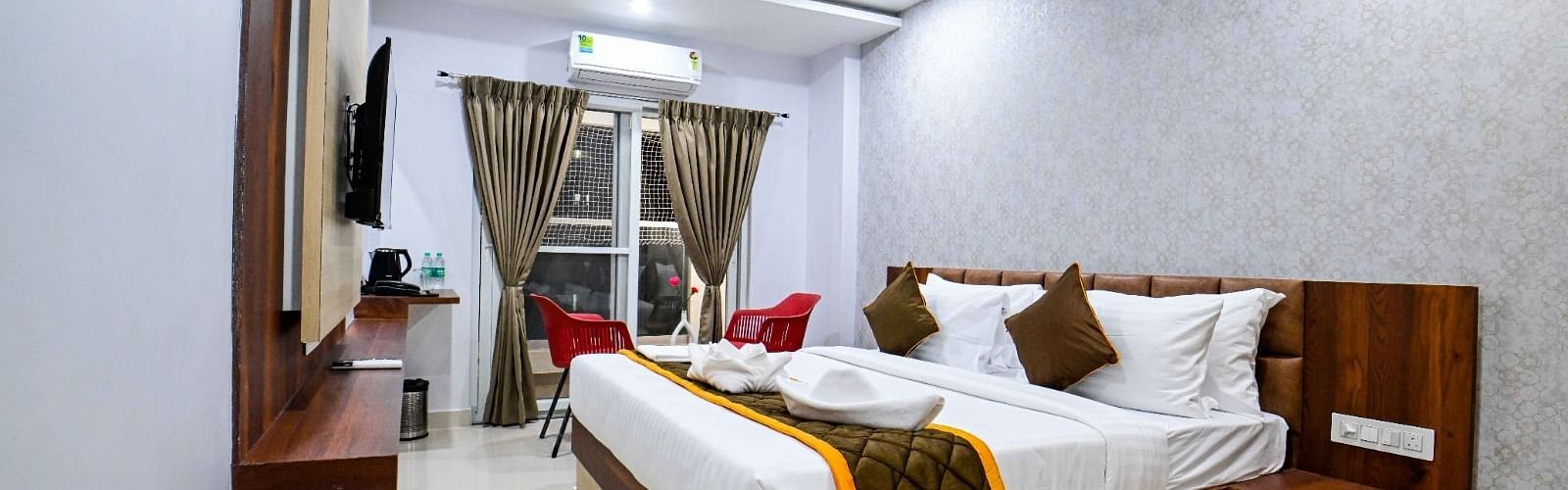 view of the king size beds at Premium Balcony Room of South Square Hotel, Bengaluru