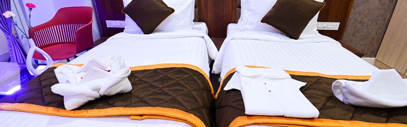 view of the twin beds of Twin Deluxe Room at South Square Hotel, Bengaluru