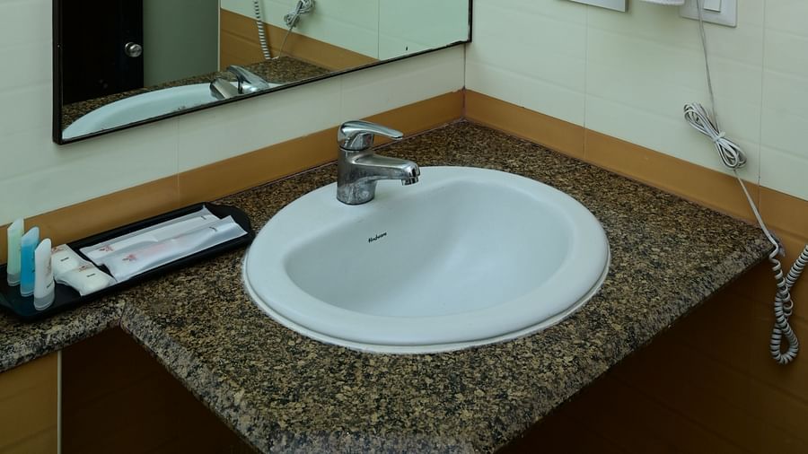 Mirror and sink at the Washroom at Executive Suite at Sterling Keys by TGI 