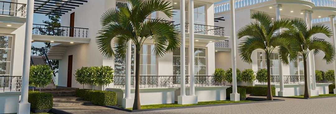 Corner view of a building with tall pillars supporting the roof from the ceiling.
