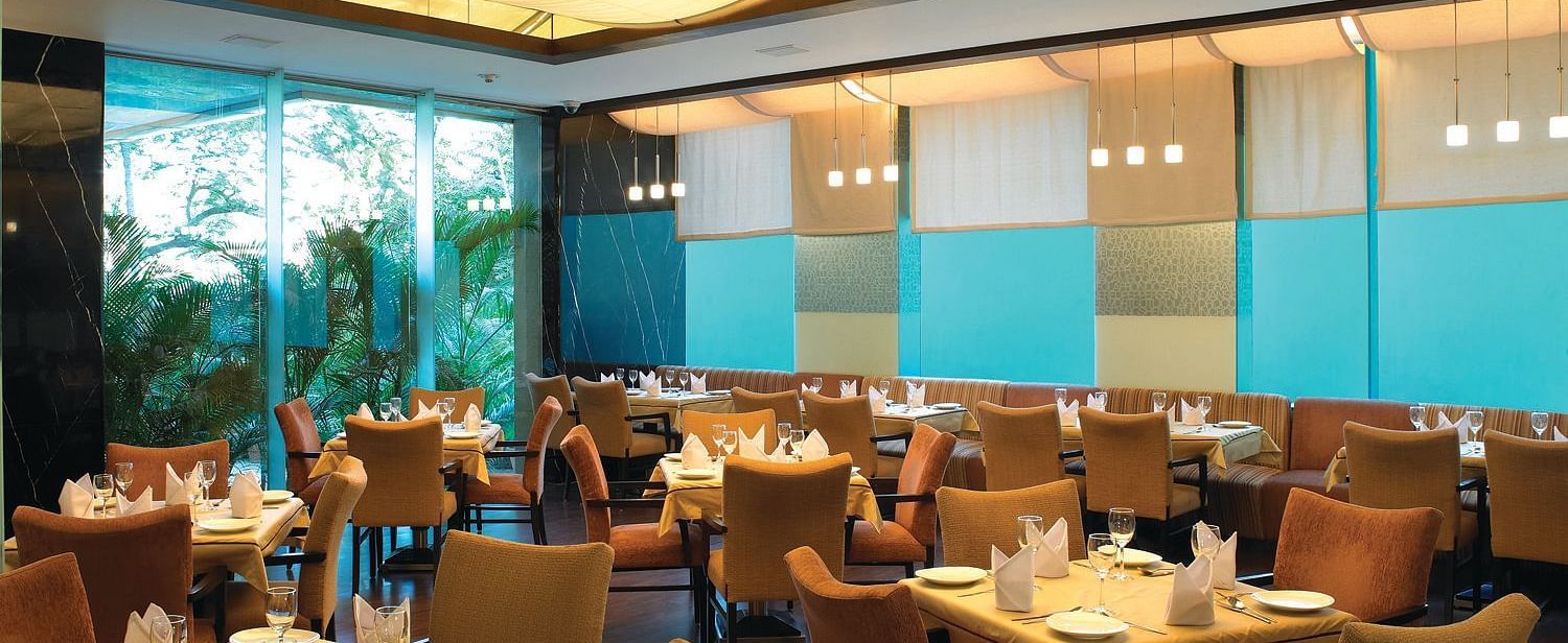 Shot of magnolia, our multi-cuisine restaurant with several seating arrangements | Mirage Hotel