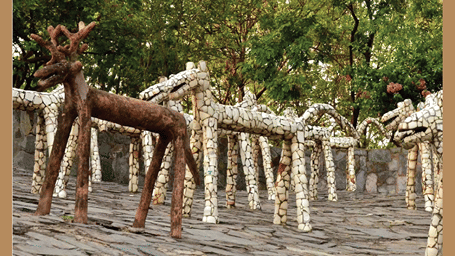 An overview of sculptures kept on a rocky area - Karma Lakelands.