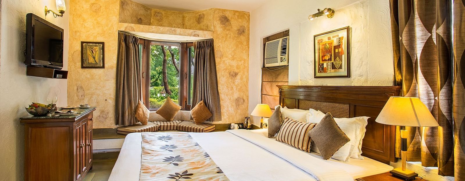 An image of a bedroom with king size bed, wooden ceiling where a fan is hanged,  cabinet and tables, etc. - The Riverview Retreat, Corbett