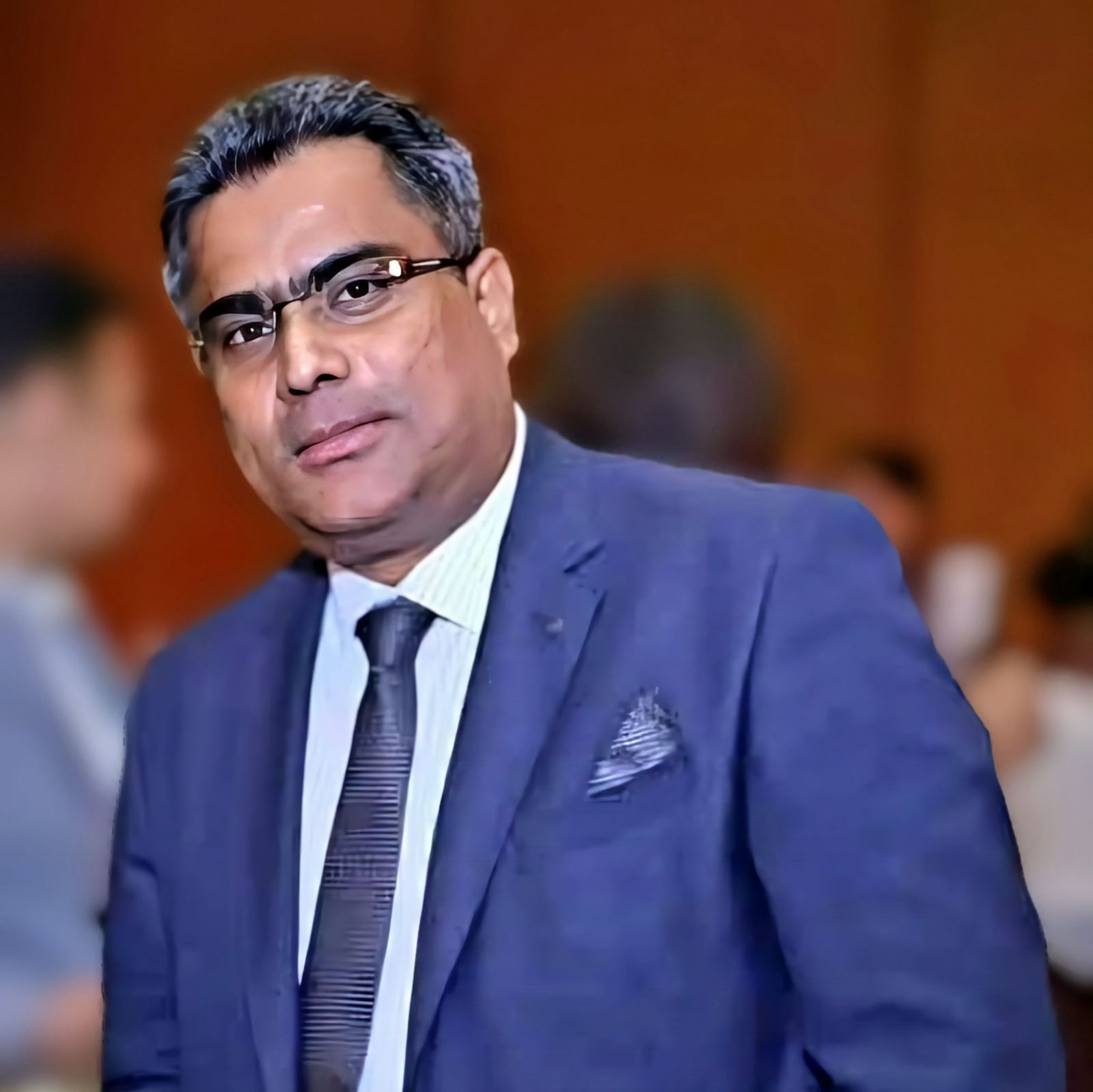 A shot of a man wearing blue formal wear at Vedic Village Spa Resort.