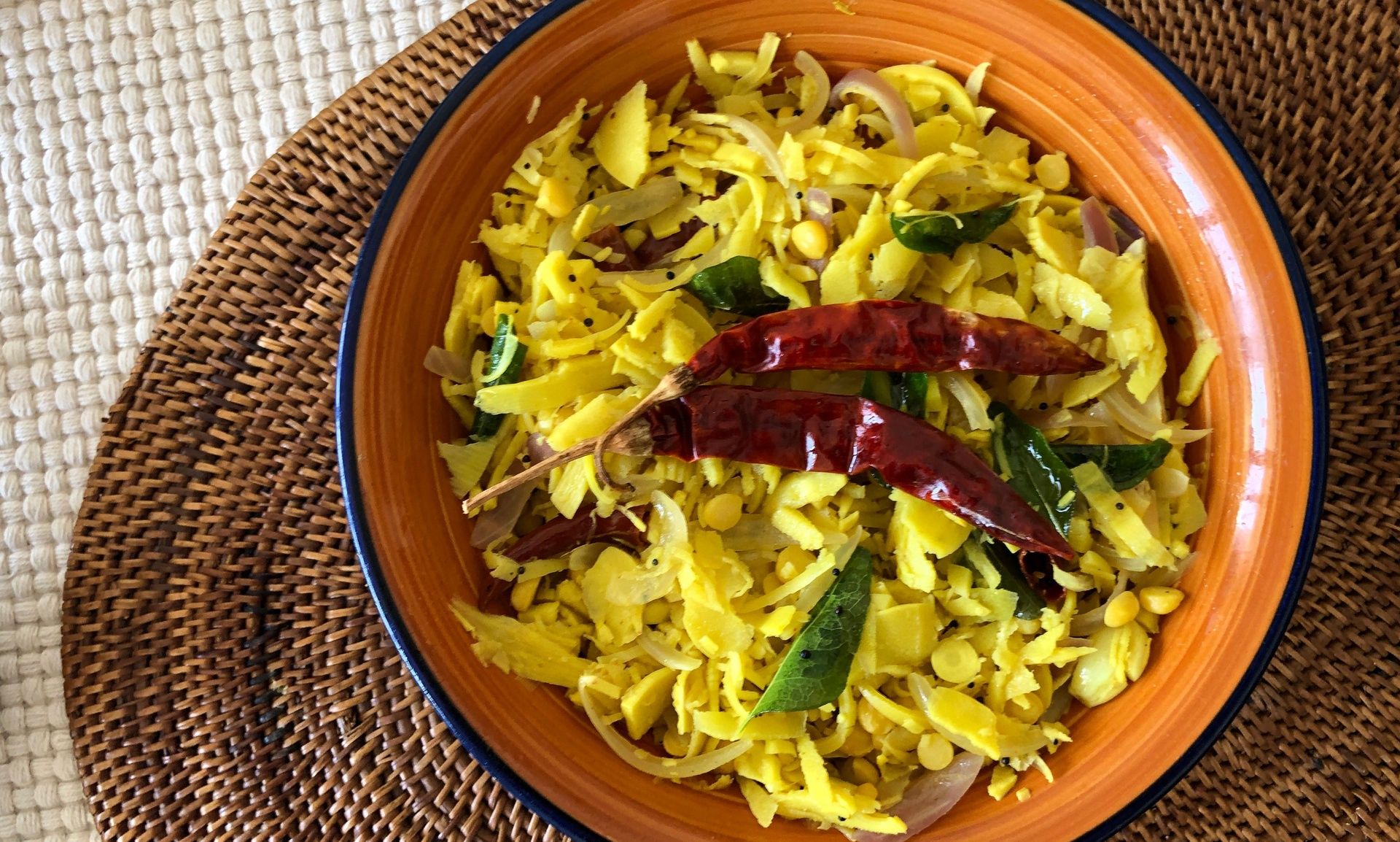 Baimbale (tender bamboo fry) garnished with red chilies.