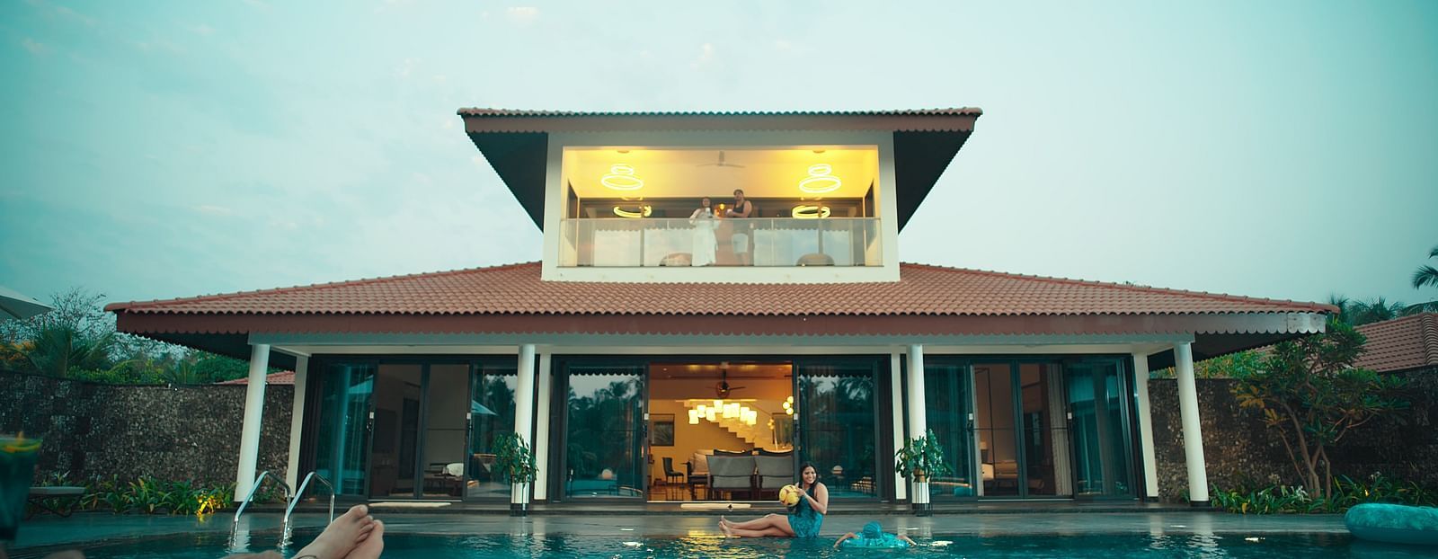 An overview of the interior facade with a swimming pool in the foreground - Gamyam Resort