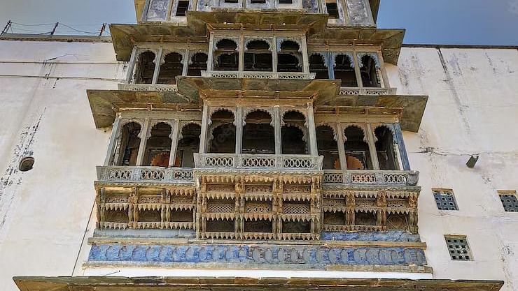 facade view of Sajjangarh fort with many windows on it - Chunda Shikar Oudi Udaipur.