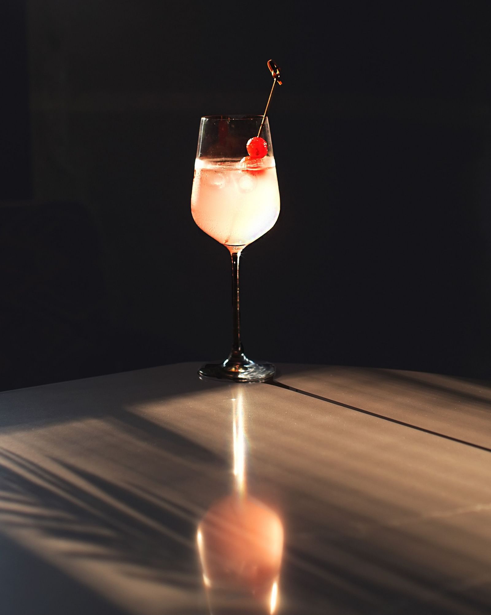 Giggle water drink in a glass with black background
