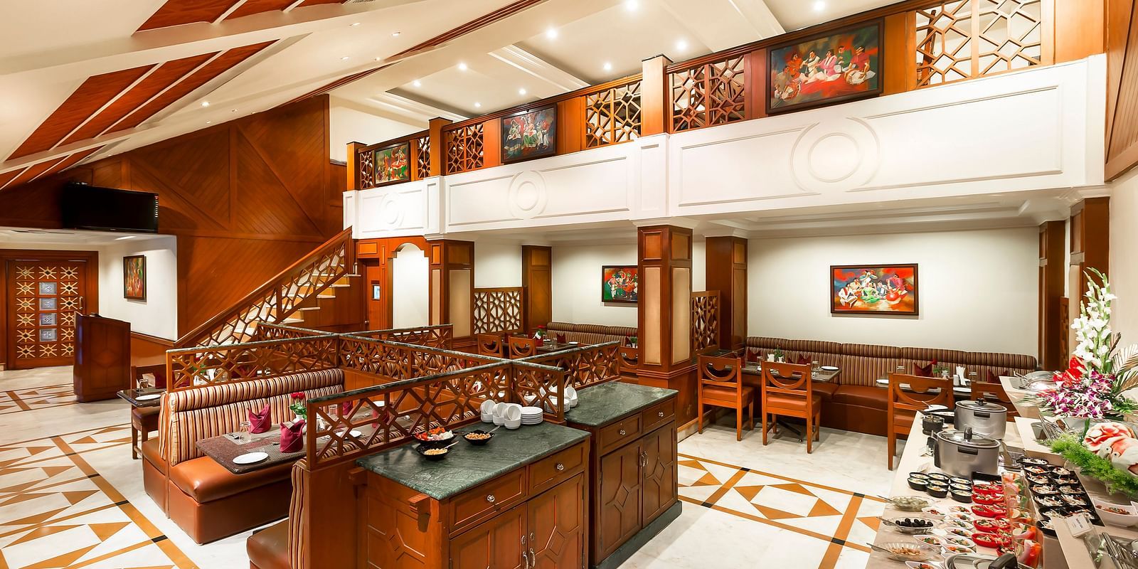 A seating arrangement of Dakshin Restaurant at Regency Kanchipuram by GRT Hotels.