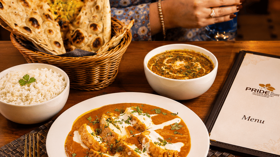 Signature Indian cuisine served in a cosy setting at Pride Ashiyana Resort Mussoorie.