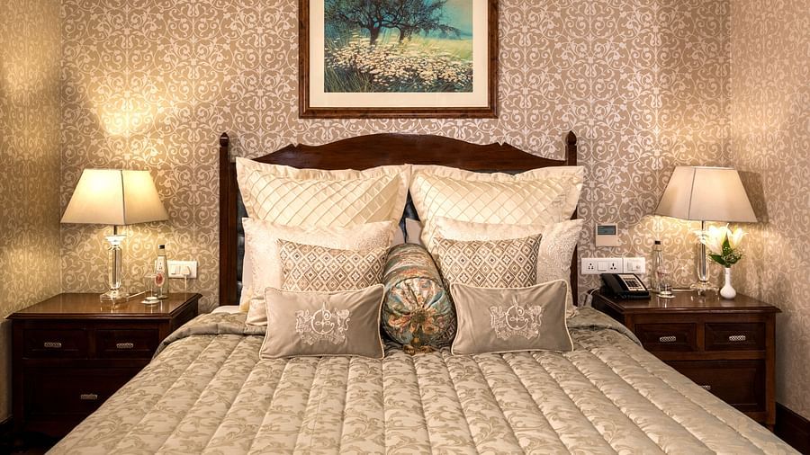 image of a king size bed at the Club Room at The Claridges Nabha Residence