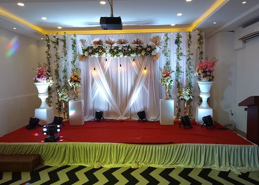 Image of  a pulpit with flower and plant decorations at Vagator Downtown, Goa