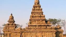 The exterior view of the Shore Temple, showing detailed stone carvings and towers.