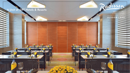 Promotional creative for Meet Smart in Bengaluru highlighting a modern boardroom setup designed for focused business meetings.