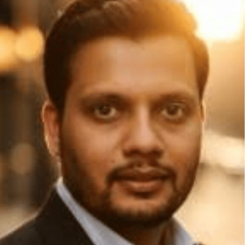 Executive team member in business suit at Pride Hotels Group