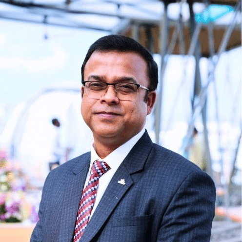 Regional General Manager in suit and tie at Pride Hotels Group.