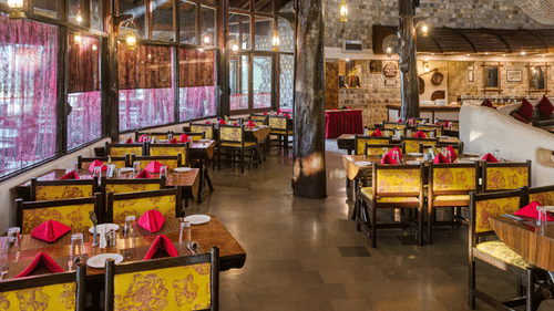 Stylish resort restaurant interior with comfortable seating and décor.