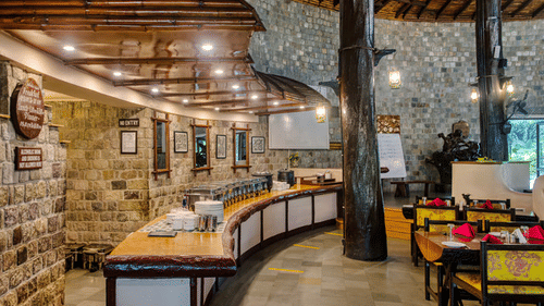Cozy resort bar and lounge area with rustic stone and wood accents.