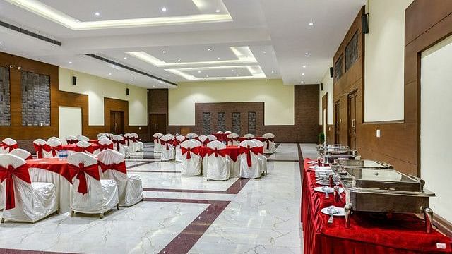alt-text Another view of the event room with tables and chairs neatly arranged.