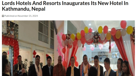 Guests and dignitaries gathered at a decorated entrance with balloons and drapes during the inauguration event of a new hotel in Kathmandu.