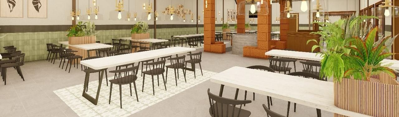 Interior view of a dining area with tables and chairs under a high ceiling | Ayana Resorts & Convention, Hyderabad